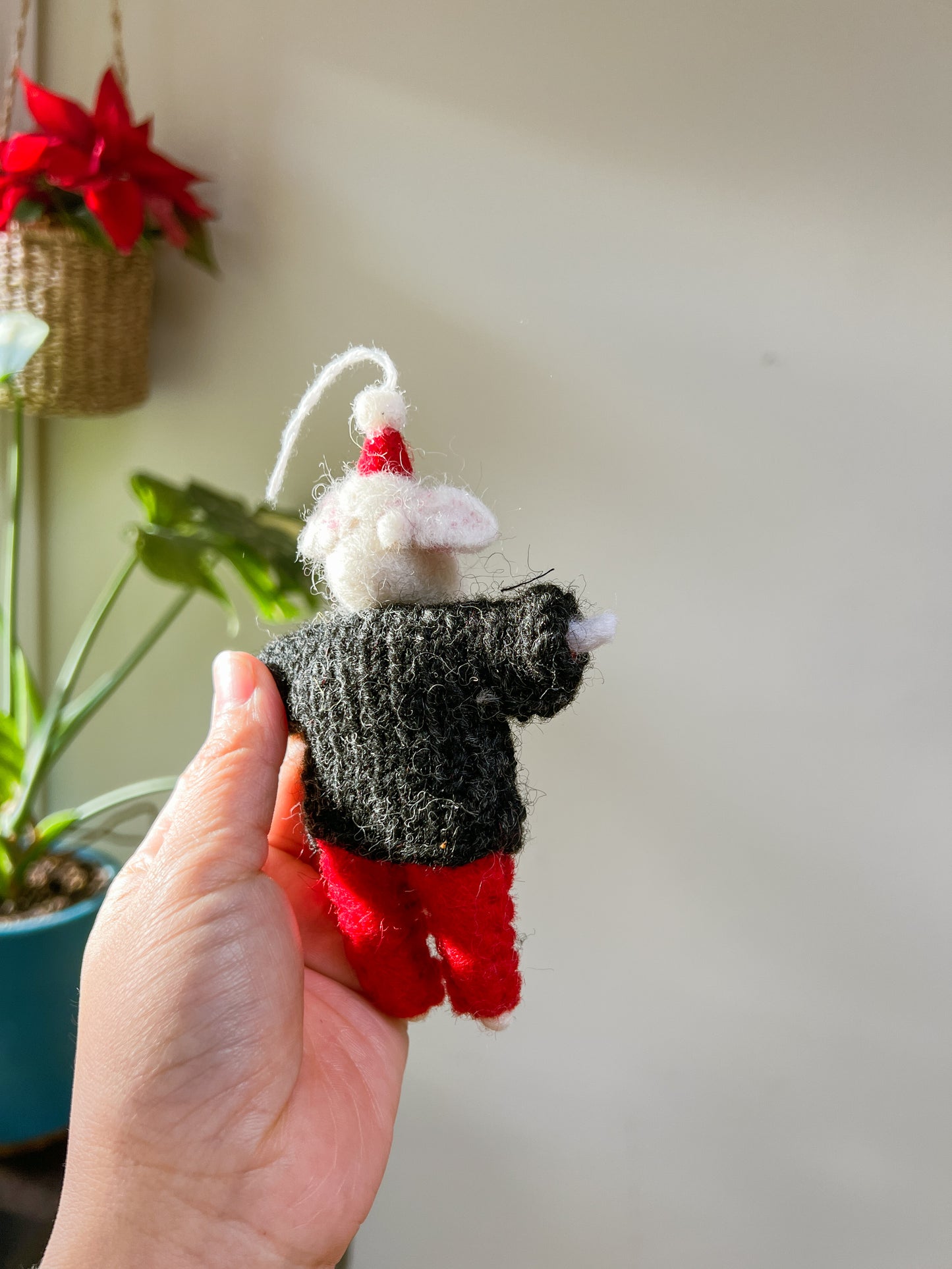 Little Mouse wears Christmas hat ornament