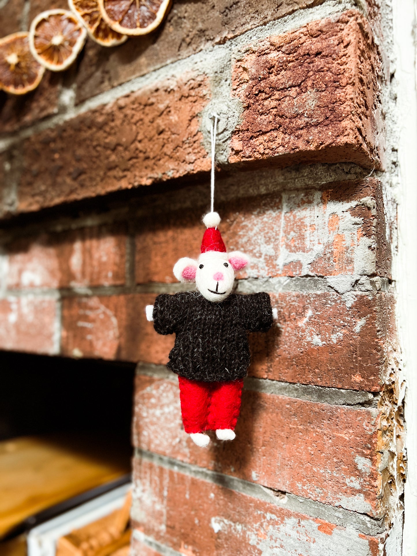 Little Mouse wears Christmas hat ornament